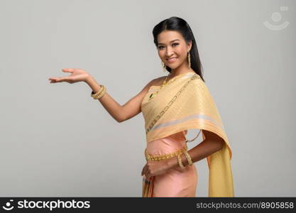 woman wearing Thai dress that made a hand symbol