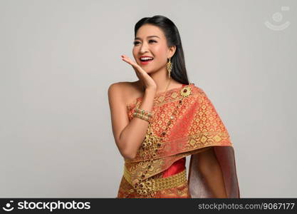 woman wearing Thai dress that made a hand symbol