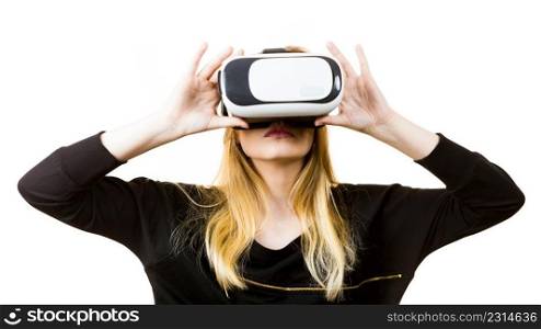 Woman wearing virtual reality goggles headset, vr box. Connection, technology, new generation and progress concept.. Woman wearing VR goggles