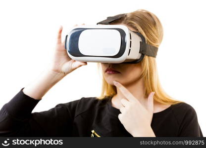 Woman wearing virtual reality goggles headset, vr box. Connection, technology, new generation and progress concept.. Woman wearing VR goggles