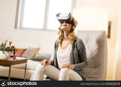 Woman wearing virtual reality goggles in the room
