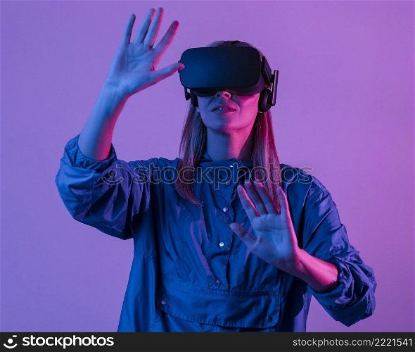 woman wearing vr glasses with purple light