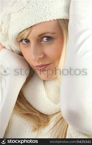 Woman wearing white hat and scarf