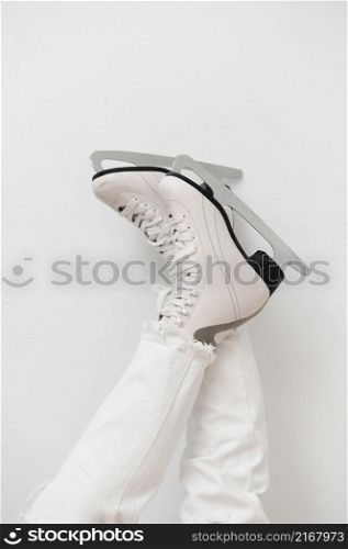 woman wearing white ice skates