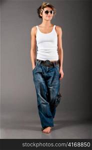 woman wearing white tank top and jeans