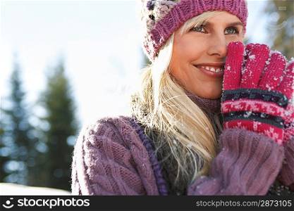 Woman wearing winter clothing smiling portrait