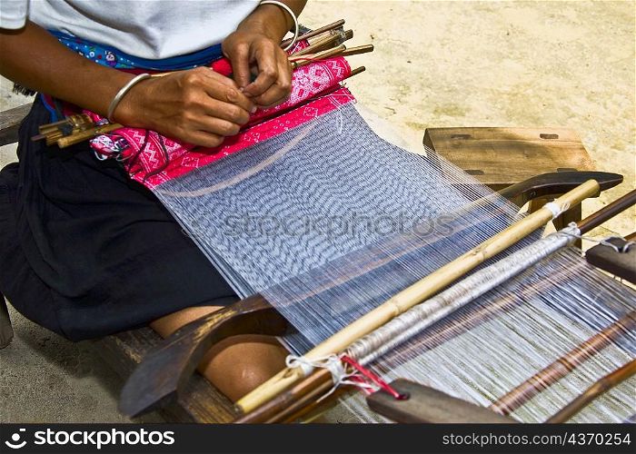 Woman weaving carpet, Jinkeng Terraced Field, Guangxi Province, China