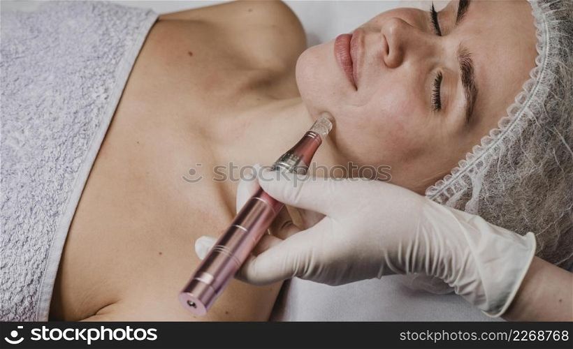 woman wellness center having skin treatment