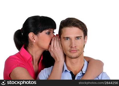 Woman whispering a secret