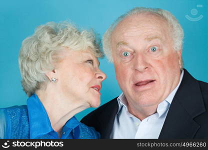 Woman whispering to husband