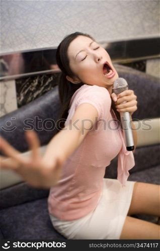 Woman who does karaoke