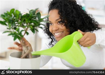 woman who plants water on a plant