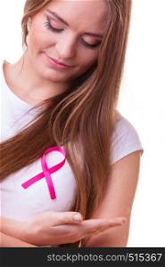 Woman wih pink cancer ribbon on chest. Healthcare, medicine and breast cancer awareness concept, isolated on white. Woman wih pink cancer ribbon on chest