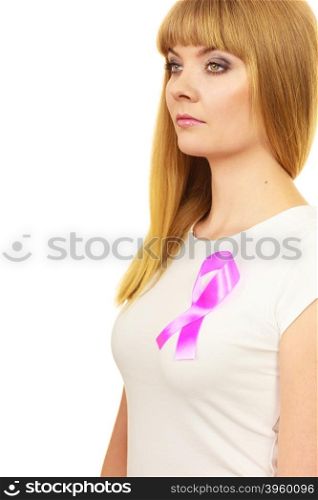 Woman wih pink cancer ribbon on chest. Healthcare, medicine and breast cancer awareness concept.