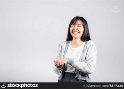 Woman winning and surprised excited screaming laughing studio shot isolated white background, Happy Asian portrait beautiful young female lifestyle cheerful smiling and laugh funny with copy space