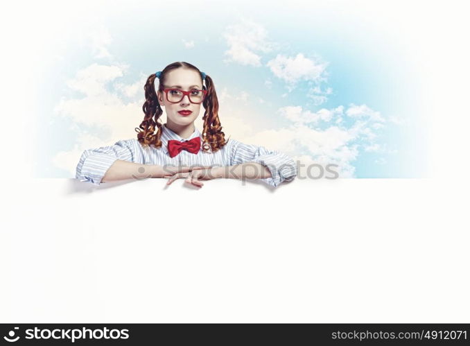 Woman with a blank billboard. Young woman holding a blank white billboard