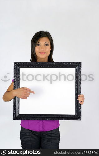 Woman with a blank picture frame