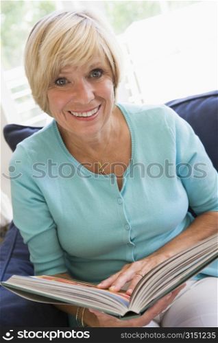 Woman with a book smiling