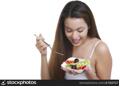 Woman with a bowl of fruits