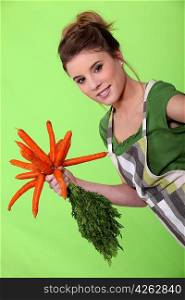 Woman with a bunch of carrots