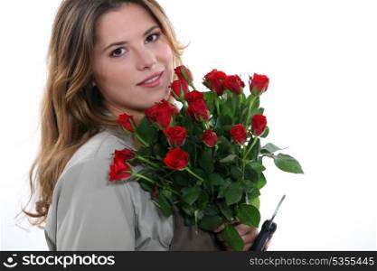Woman with a bunch of red roses
