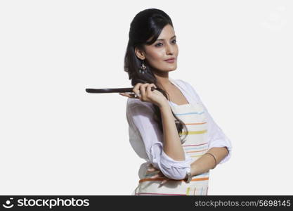 Woman with a cooking utensil