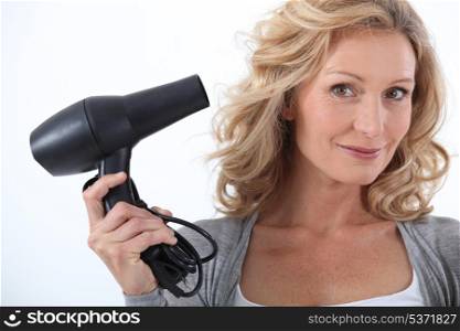 Woman with a hairdryer