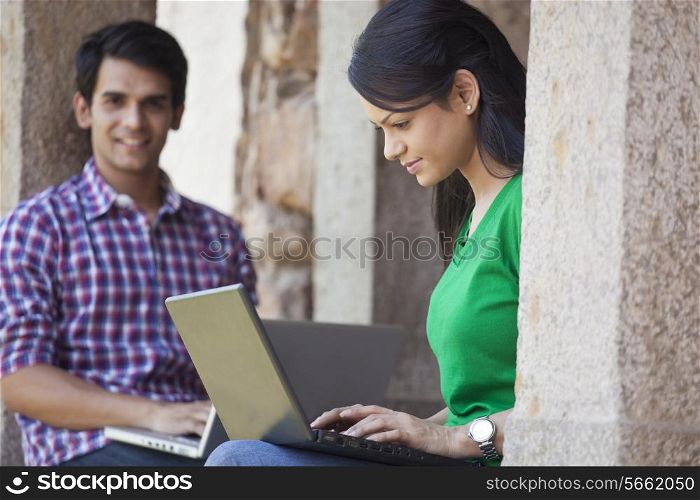 Woman with a laptop in a fort