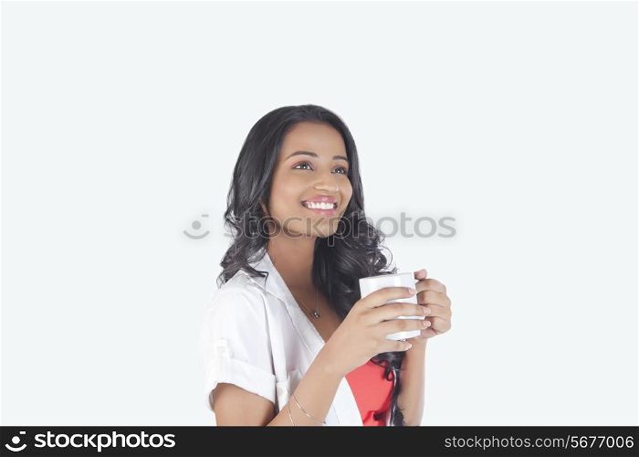 Woman with a mug of tea smiling