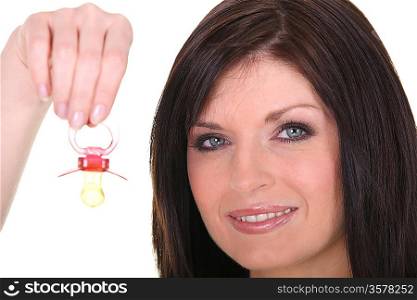 Woman with a pacifier for baby