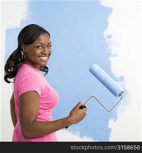 Woman with a paint roller