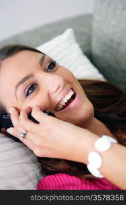 Woman with a phone in bed