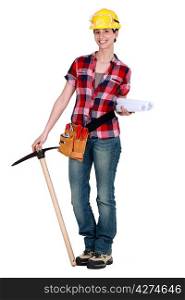 Woman with a pickaxe and plans