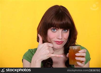 Woman with a pot of honey