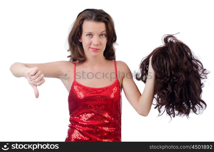 Woman with a selection of wig isolated on white