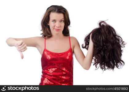 Woman with a selection of wig isolated on white