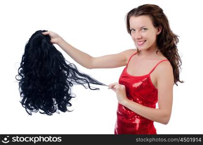 Woman with a selection of wig isolated on white