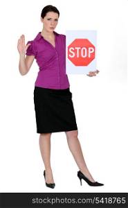 Woman with a stop sign