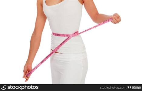 Woman with a tape measure measuring her waist isolated on a white background