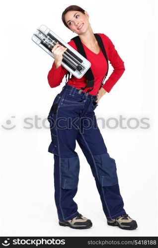 Woman with a tile cutter