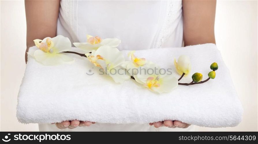Woman with a towel and orchids