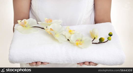 Woman with a towel and orchids