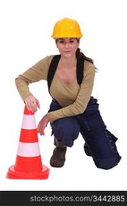 Woman with a traffic cone