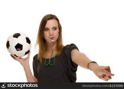 woman with a whistle holding a football pointing at something. woman with a whistle holding a football pointing at something on white background