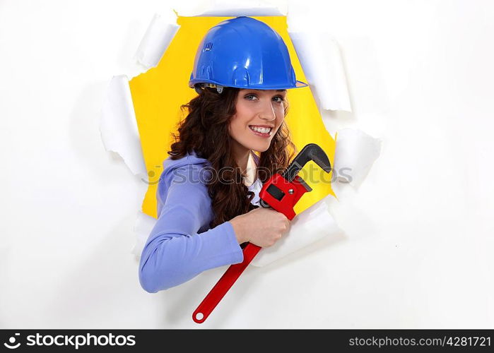 Woman with a wrench and hardhat