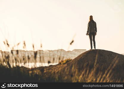 Woman with a yellow cap enjoying the view