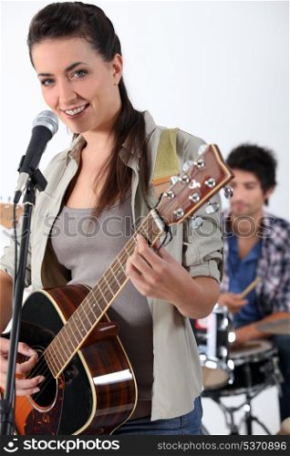 Woman with acoustic guitar