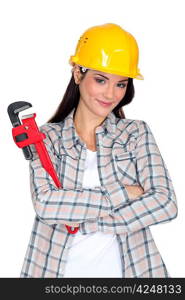 Woman with an adjustable wrench