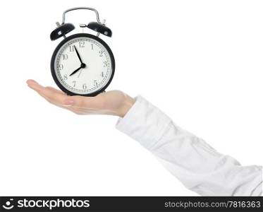 woman with an alarm clock in a hand. Isolated on white background