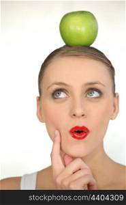 woman with an apple on her head